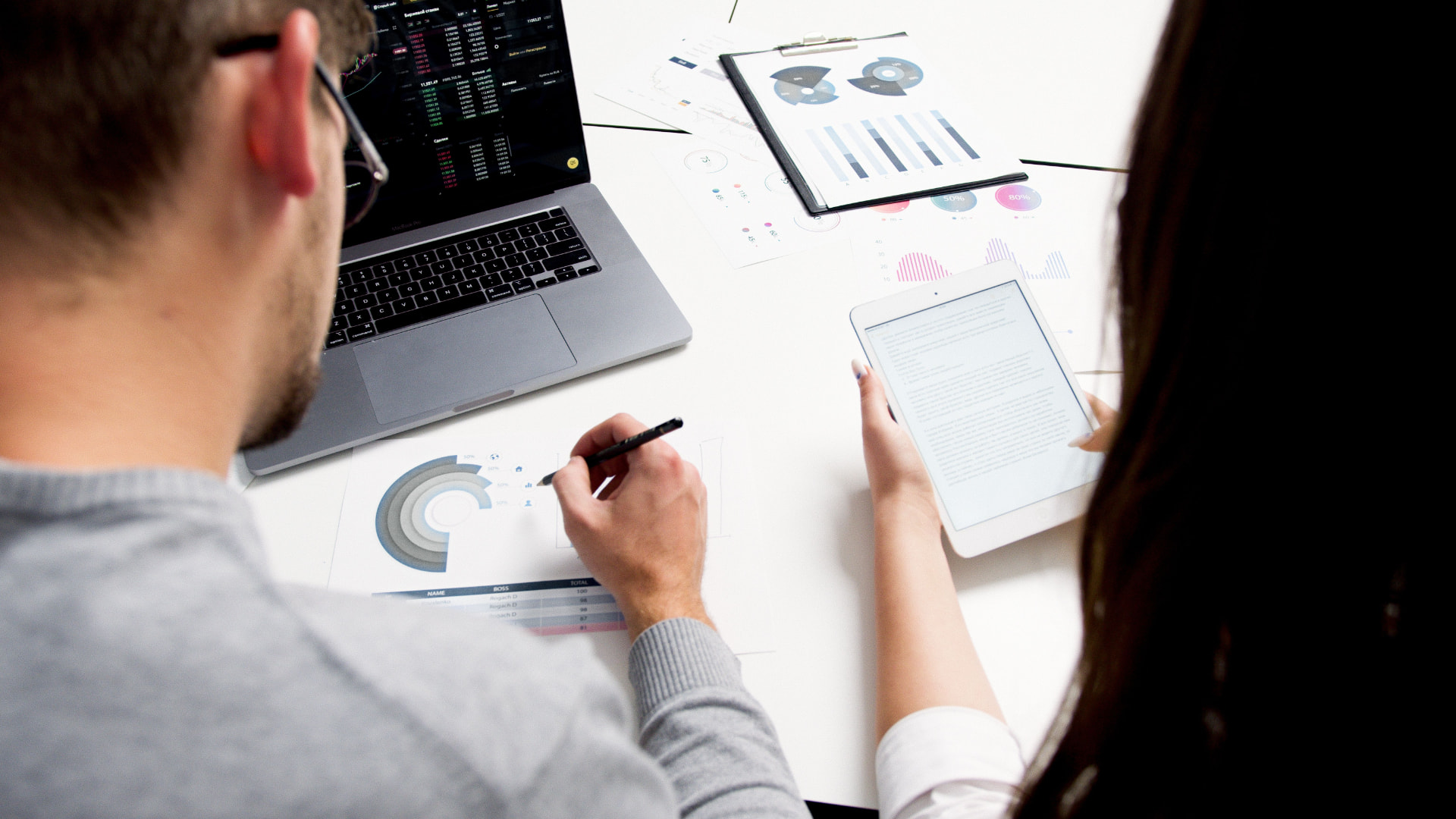 Marketing team reviewing performance dashboards and analytics reports